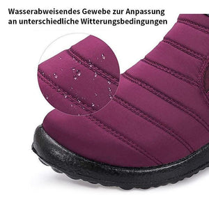 Männliche und weibliche Paare Schneeschuhe